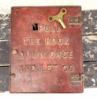 Front view of closed box showing raised lettering and surface wear