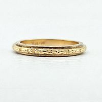 Side profile of etched band ring showing engraved detail