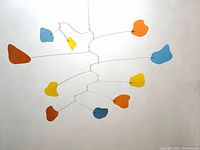 Full front view of hanging mobile showing overall shape and balance