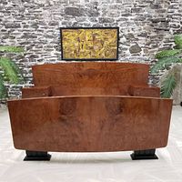 Front view of queen bed frame showing headboard, footboard, and attached nightstands