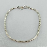 Sterling silver snake chain bracelet laid flat
