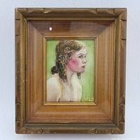 Framed watercolor painting showing full view of a female bust in profile with green background, wooden frame with carved accents