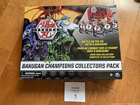 Front face of the unopened Bakugan Champions Collectors Pack box showing 6 Bakugan figures included.