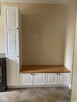 Full view of two-piece IKEA storage unit showing tall cabinet on left and shoe storage bench with wooden top below