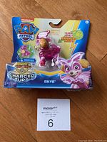 Photo of unopened Paw Patrol Mighty Pups Skye figure with original packaging.