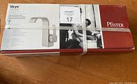 Photo of unopened sealed box containing Pfister Skye single hole brushed nickel faucet showing product branding, model, and packaging condition.