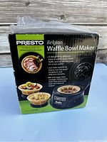 Photo of the Presto Belgian Waffle Bowl Maker box showing product information and branding