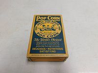 Top-down view of vintage Jolly Time popcorn box showing brand name, slogan, and copyright dates.