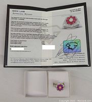 Photo of the appraisal report and ring in display box.