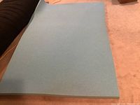Blue memory foam sheet laid flat showing full size.