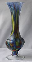 Large 10 inch tall vintage Italian Murano glass vase with swirling multicolor pattern and signed base, shown against white background.