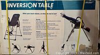 Front of the sealed box for the Life Gear Inversion Table showing product image and measures 27"H x 49"W.