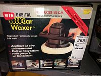 Front view of Wen Orbital Car Waxer box showing product branding, features, and promotional images.