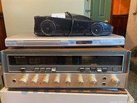 Main view showing Philips DVD player, car-shaped CD player, Sansui receiver stacked