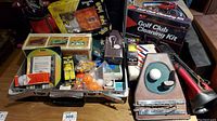 Overview of all golf-related items including the cleaning kit box, mini golf clubs, golf balls, and indoor putting accessories.