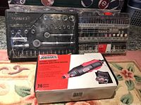 Jobmate rotary tool kit box and two accessory cases displayed on carpet.