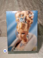 Front of the boxed Barbie Crystal Jubilee doll showing collectible packaging with artwork and branding.