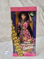 Front view of Chinese Barbie Doll in original unopened packaging showing the doll in pink and black floral traditional Chinese dress.