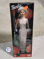 Full view of Holiday Excitement Barbie doll in original box with packaging text and price sticker visible.
