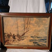 Full view of framed marine painting showing ships in stormy sea with wooden frame