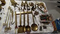 Full top view of the brass utensils, miniature pottery, brass figurines and miscellaneous small items