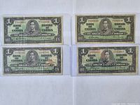 Four 1937 Canadian one dollar bills in protective cases, showing front sides with serial numbers visible.