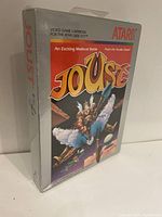 Front view of the Atari 2600 Joust game cartridge sealed in original box showing logo and artwork