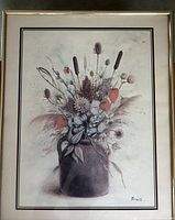 Photo of front of framed print showing wildflower jug artwork by Trinite, signature visible, frame with metallic finish and double matte