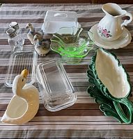 Photo showing entire lot with all containers, salt and pepper shakers, gravy boat, pitcher, and decorative dishes