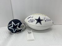 Front view showing white panel football and navy blue mini helmet side by side