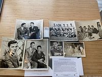 Overhead view of seven black-and-white photographs laid out