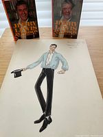 Two books and one illustration (#11) on tabletop