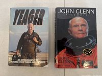 Overview of two hardcover memoirs 'Yeager' and 'John Glenn: A Memoir' side by side