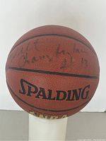 Front panel view showing Wilt Chamberlain signature above Spalding logo