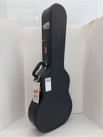 Exterior view of closed case standing upright showing shape and finish