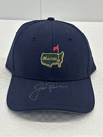 Front view of navy blue hat showing embroidered Masters logo and silver Jack Nicklaus signature on brim
