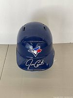 Front view showing Blue Jays logo and Joe Carter silver signature on bill