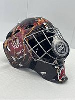 Front side angled view showing autograph and NHL official licensed product tag