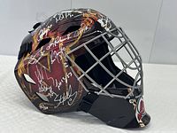 Right side view showing silver cage, flame graphics and multiple white ink signatures