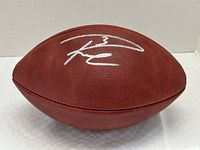 Football displayed on its side showing overall Russell Wilson signature