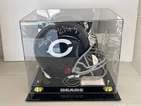 Full view of navy blue Bears helmet in clear acrylic case on black base