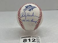 Front view showing 1989 World Series logo above Rickey Henderson signature and inscription
