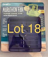 Photo of the Circulair Marathon Fan battery operated desk fan showing front of the sealed packaging with product features.