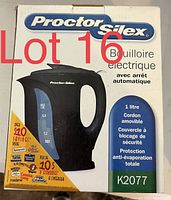 Photo of the Proctor Silex electric kettle box showing product image and details including model K2077, capacity 1 litre, removable cord, safety lid lock, automatic shut-off, and energy savings.