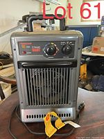 Metal Honeywell Heat Giant space heater with visible control dials and power switch, front grill and carry handle