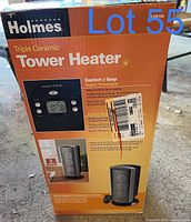 Box front showing model and features of Holmes Triple Ceramic Tower Heater including digital thermostat.