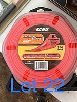 Package of Echo Cross Fire .095-inch diameter, 250 feet length trimmer line in orange color with clear labeling for professional grade use.