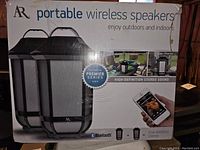 Box front showing AR brand portable wireless speakers and Bluetooth wireless capability for indoor and outdoor use.