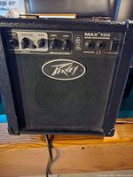 Front view of Peavey Max 126 bass guitar amplifier showing control panel and Peavey logo on the grille