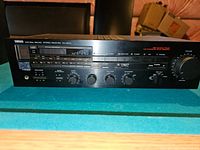 Front panel view of the Yamaha RX-500U Natural Sound Stereo Receiver showing controls and tuning display.